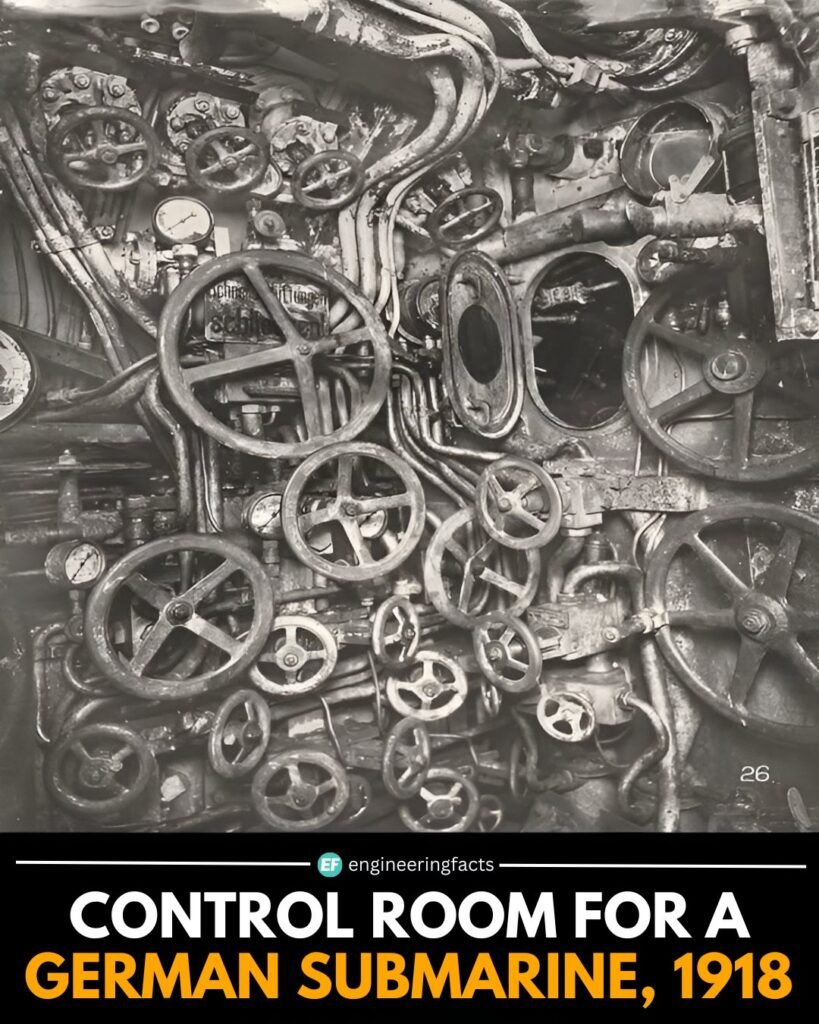 This chaotic-looking maze of wheels, pipes, and gauges is the control room of a German U-boat from 1918, captu